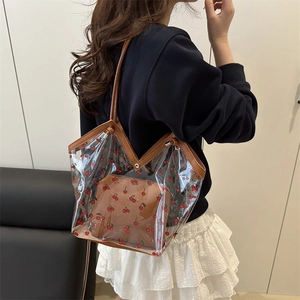 Transparent PVC tote bag with cherry prints and a brown PU leather inner pouch