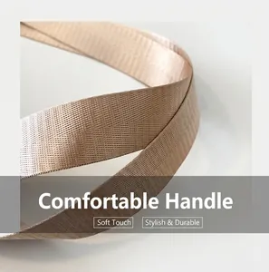 Detail of high-density nylon woven handle with champagne gold twill texture on a school bag