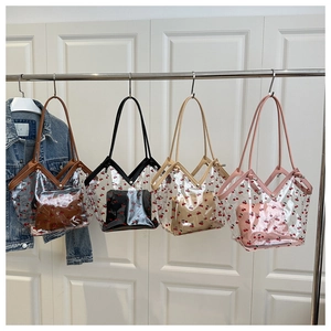 Transparent PVC tote bags with cherry prints and colored leather handles in four styles