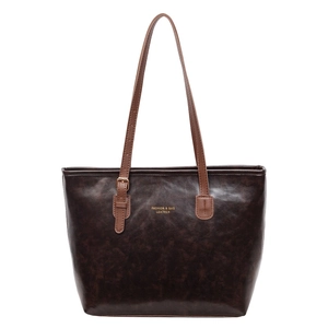 Retro dark brown leather tote bag with adjustable straps and fashion gold lettering