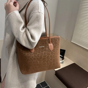 Brown leopard print tote bag with white FASHION text for winter casual outfit
