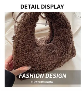 Detail view of dark brown curly faux fur texture and silver zipper on fuzzy handbag