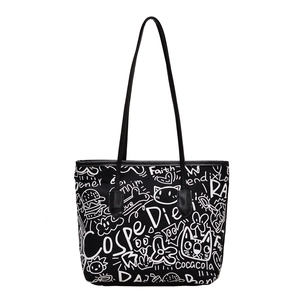 Minimalist black tote bag with white graffiti cat and heart prints for daily commuting