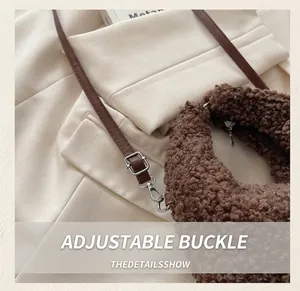 Detailed close-up of the adjustable metal buckle on the brown plush faux fur tote bag