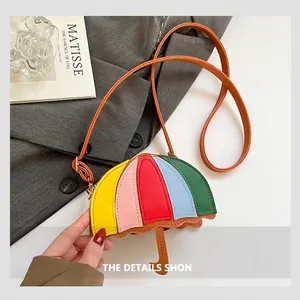 Detail of umbrella-shaped crossbody bag with colorful PU leather and brown shoulder strap