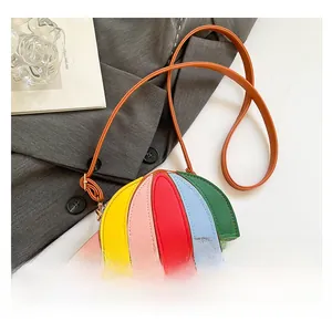 Detail of umbrella-shaped crossbody bag with colorful PU leather and brown shoulder strap