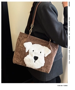 Detail of brown corduroy tote bag featuring a cute schnauzer patch and chain strap