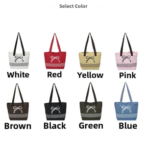 Detail showing eight available colors of canvas shoulder bags with ribbon embroidery