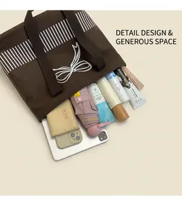 Interior view showing the large capacity of the brown canvas tote bag for essentials