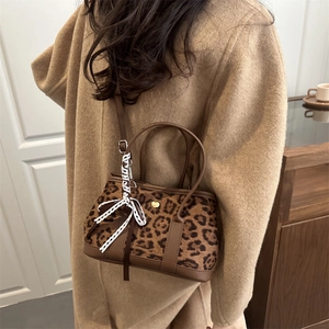 Chic leopard print faux fur tote bag with brown leather handles for autumn fashion