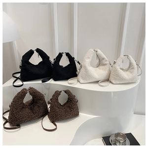 Plush lamb wool bags in black, white, and brown shown in two sizes on a display
