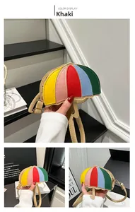 Detail of creative umbrella-shaped crossbody bag with rainbow color panels and khaki base