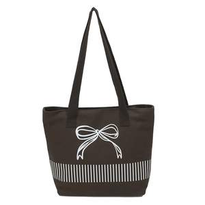 Large brown canvas tote bag with white bow pattern and vertical stripes for daily commute