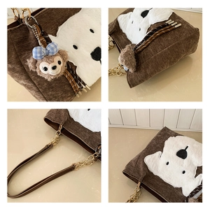 Detail view of brown corduroy tote bag featuring plush animal patch and gold chain strap