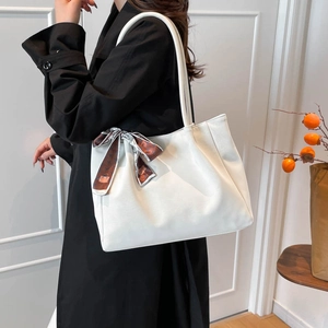 Minimalist white large-capacity PU leather tote bag with a stylish silk scarf accessory