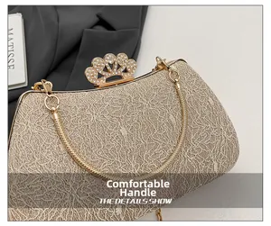Detail of evening bag with crown clasp, sparkling rhinestones and champagne lace texture