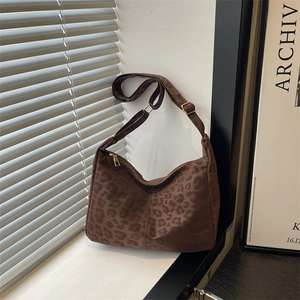 Vintage leopard print tote bag with adjustable shoulder strap and gold hardware accents