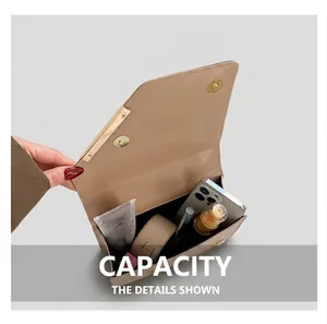 Detailed interior of the apricot cherry shoulder bag showing capacity for daily essentials