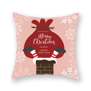 Détail de la housse de coussin de Noël avec imprimé Père Noël et motifs de flocons