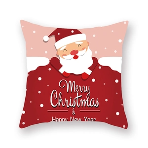 Gros plan de l'imprimé Père Noël sur la housse de coussin festive en peau de pêche