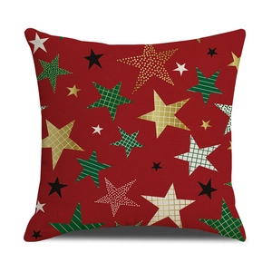 Funda de cojín navideño roja con patrones de estrellas festivas y texturas sobre fondo blanco