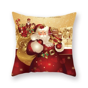 Détail de l'imprimé Père Noël et Casse-Noisette sur une housse de coussin de Noël rouge et or