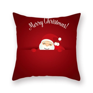 Détail d'une taie d'oreiller de Noël rouge avec le Père Noël et texte Merry Christmas