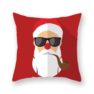 Détail de la housse de coussin de Noël rouge avec un motif moderne du Père Noël
