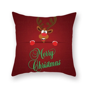 Détail de la texture du tissu d'une taie d'oreiller de Noël rouge avec un renne mignon