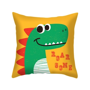 Detail of yellow pillow case with green cartoon dinosaur print and Roarsome text