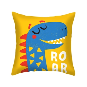 Detail of yellow pillowcase featuring blue cartoon dinosaur print and white Roar text