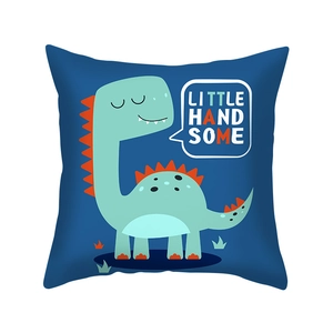 Detail of navy peach skin cushion cover with green dinosaur and LITTLE HAND SOME print
