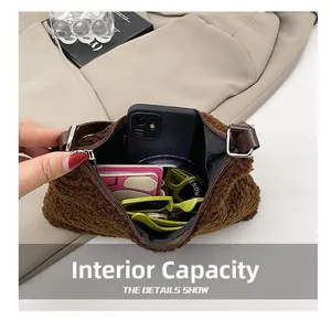 Detail view of the brown plush bag showing interior capacity for phone and accessories