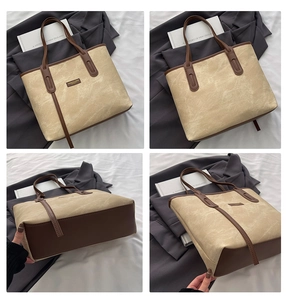 Detail view of retro tote bag showing canvas texture, leather base, and spacious interior