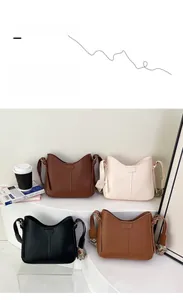 Detailed view of bucket bags in four colors with stylish jacquard wide shoulder straps
