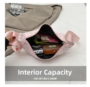 Internal capacity of pink plaid canvas waist bag showing daily storage essentials