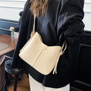 Vintage cream white bucket bag with wide strap and minimalist buckle design for women