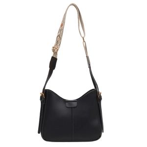 Classic black saddle bucket bag with patterned wide shoulder strap on white background