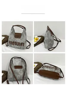 Detailed views of grey canvas tote bag with brown leather trim and retro letter patch
