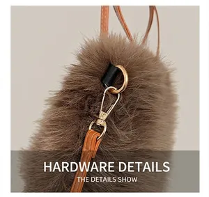 Close-up of golden hardware and leather strap on brown plush faux fur handbag