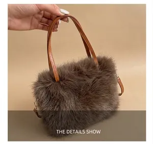 Detail of plush faux fur tote bag with brown leather handles and white contrast stitching