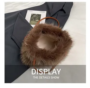 Detailed top view of brown faux fur handbag with soft texture and leather strap