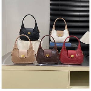 Detail view of woven leather handbags with gold rectangular buckles in five colors