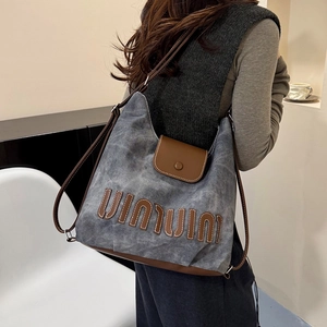 Vintage large-capacity blue canvas hobo bag with leather straps and patch details
