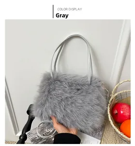 Detail showing the gray faux fur texture and matching handles of this winter handbag