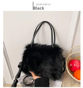 Detail of black faux fur bucket bag with leather handles and detachable shoulder strap