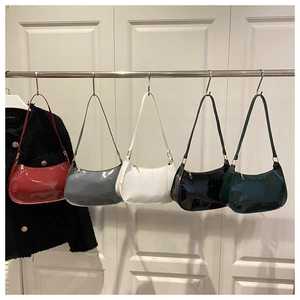 Five glossy patent leather shoulder bags in red, grey, white, black and green with gold zippers