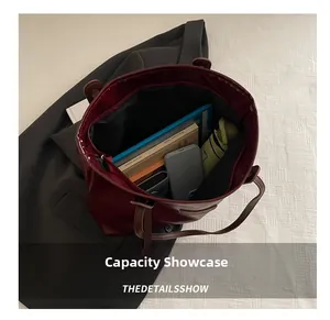 Detail view of large capacity tote bag interior with tablet and daily essentials