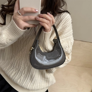 Mini laser patent leather crescent bag in dark grey with metallic finish and gold zipper