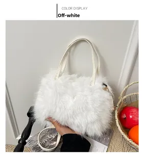 Detail of off-white faux fur bucket bag with leather handles and gold metal hardware